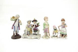 A Sitzendorf figural group and three Naples figures including child feeding chickens and couple with