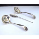 A silver sugar sifting spoon, Birmingham 1903, silver sauce ladle, Sheffield 1919 and a silver