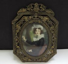 A Mid 19th Century miniature watercolour on ivory oval panel depicting young female artist with