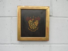 A wooden panel from an 18th Century coach, painted with a heraldic shield with motto 'Vincit Omnia
