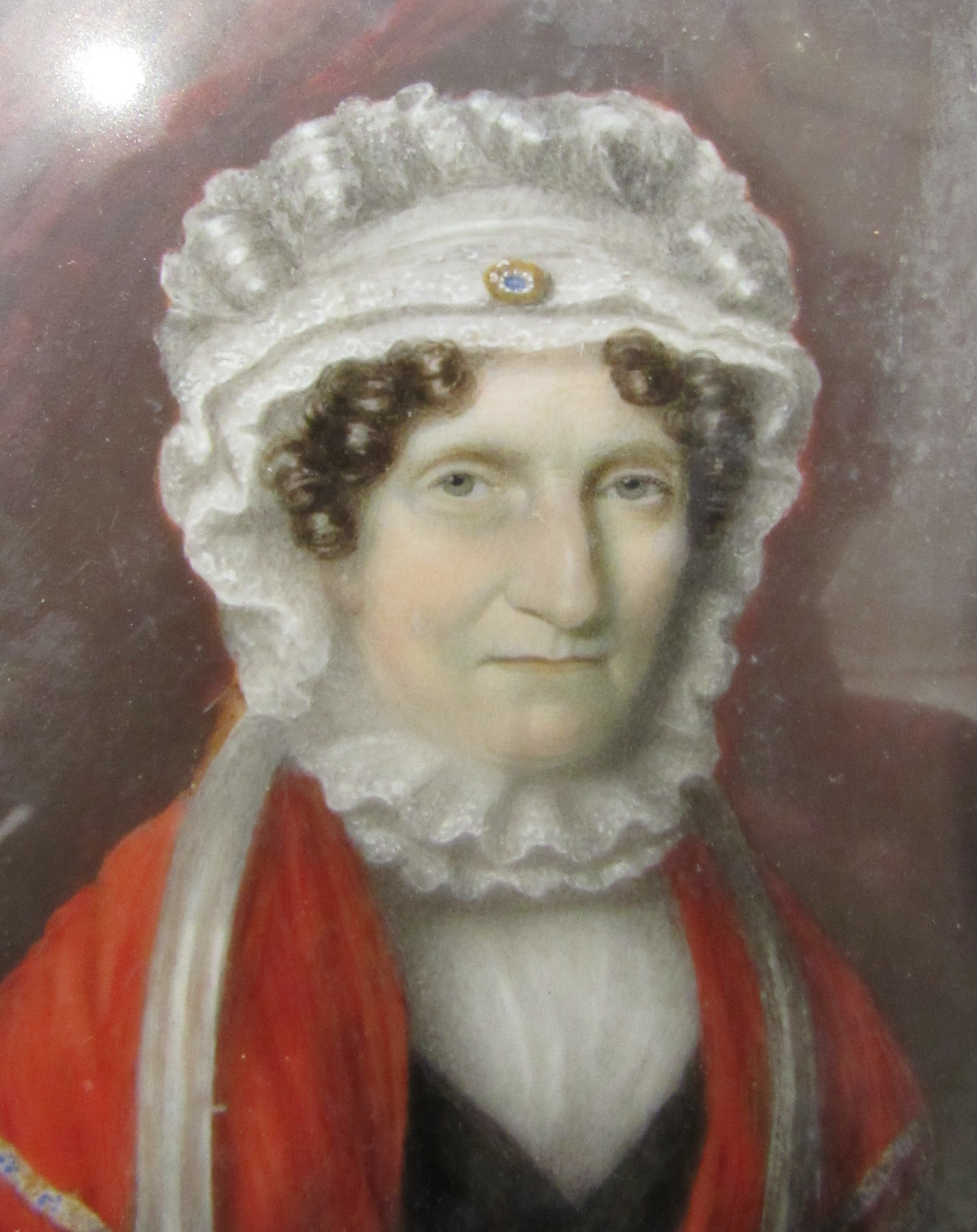 A 19th Century watercolour on ivory panel of a woman in white bonnet and red cloak. Unsigned. Set in - Image 3 of 4