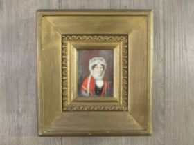 A 19th Century watercolour on ivory panel of a woman in white bonnet and red cloak. Unsigned. Set in
