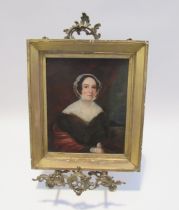 A 19th Century English School portrait of a Lady wearing bonnet with black hair and rosy cheeks, oil