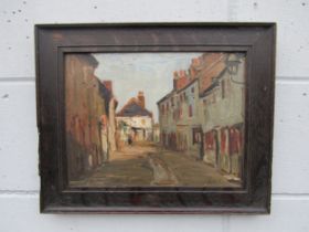 In the manner of Walter Sickert (1860-1942) An oil on wooden panel depicting a street scene.