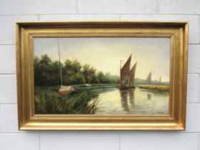 PERCY LIONEL (XIX/XX) A framed and glazed oil on canvas of Wherries on the Broads. Signed bottom