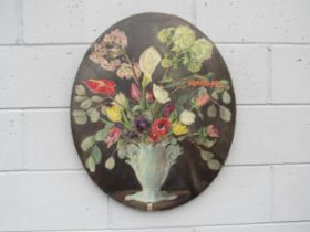 A late 19th Century oval oil on canvas, still life of a vase of flowers. Stylised VB monogram bottom
