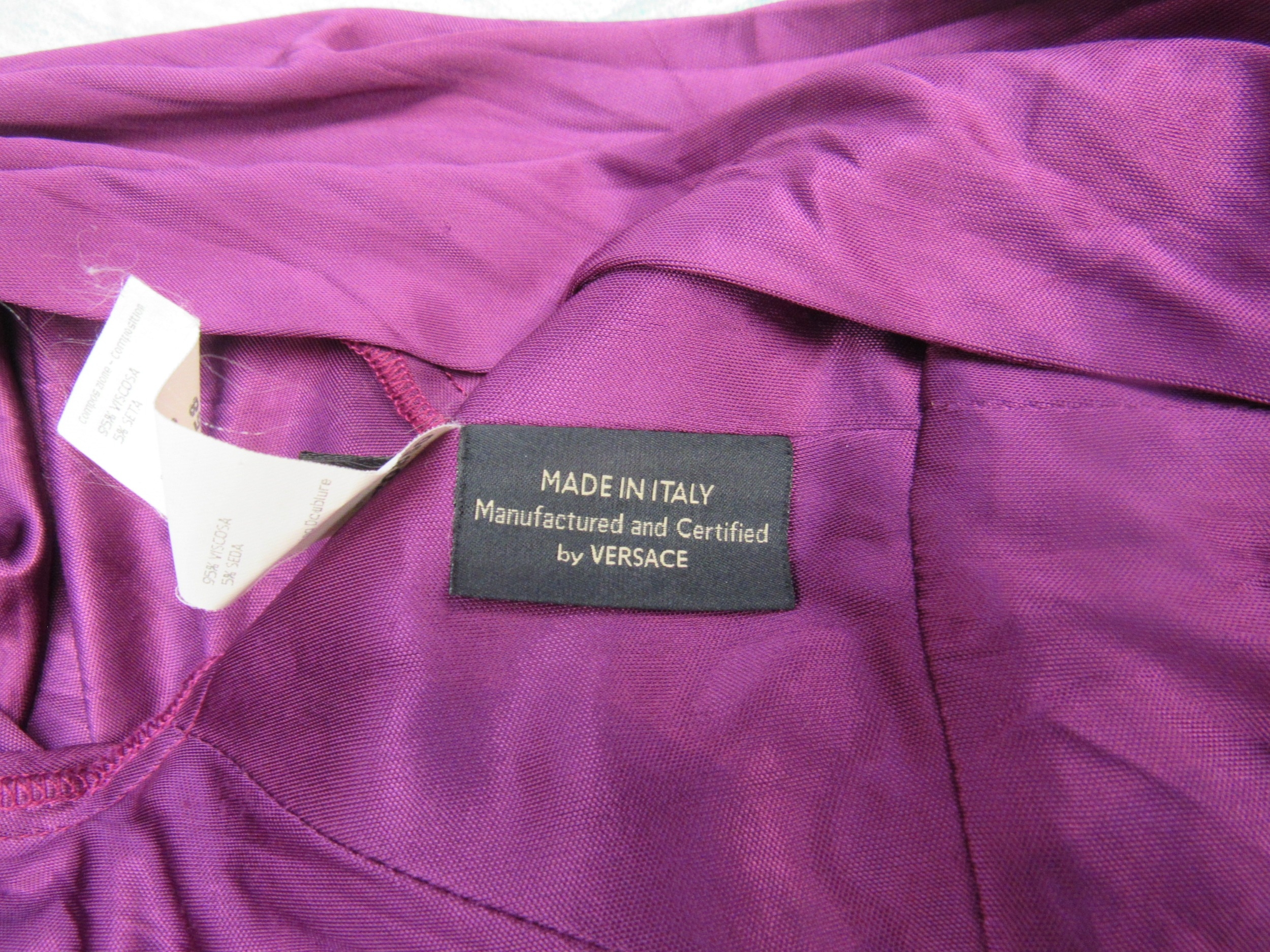 VERSACE: A purple viscose and rayon long sleeve dress with a heavily ruched bodice and deep "V" - Image 5 of 5