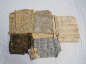 A box containing various textiles including Arts & Crafts table cloth, roll of French linen