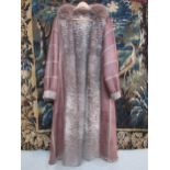 A superb modern buff leather Persian lamb lined ladies 3/4 length coat, the coat has all over