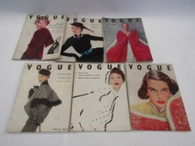 Twelve mid 20th Century Vogue magazines: August 1949 x 1 , January, July, August, October, November,