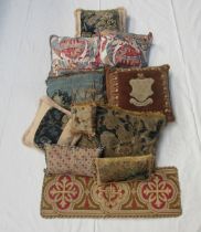 Ten country house style tapestry cushions, one with armorial crest, a pair of cushions depicting hot