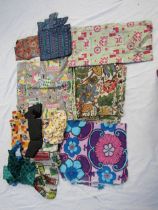 A quantity of 1930's - 1950's designs of fabrics, covered boxes and folders plus a small selection