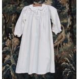 A "Damask England" crisp white cotton child's nightdress, the yoke embroidered with pale blue