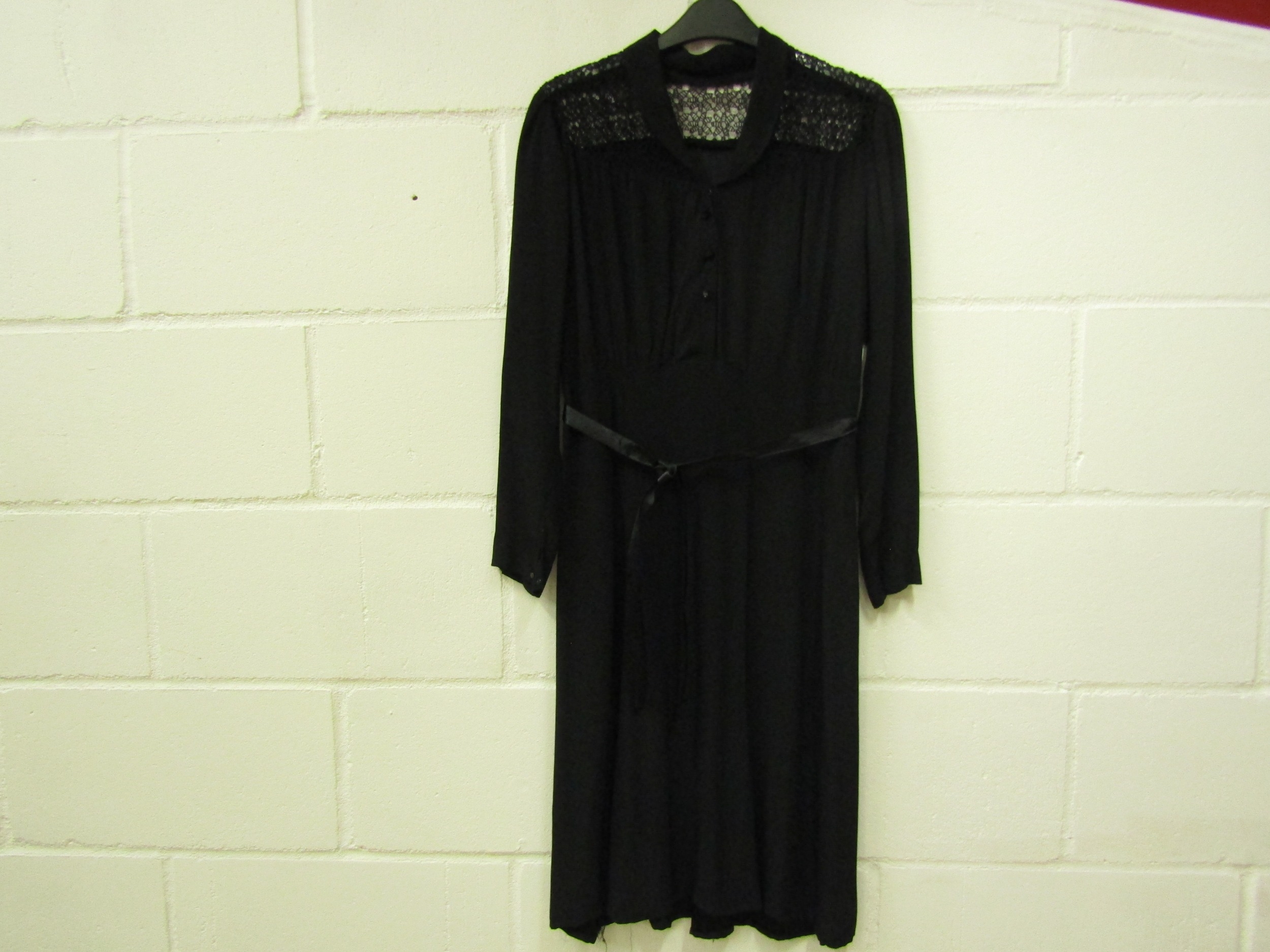 A 1940's silk crepe dress, the yoke has open lacework detail, with a popper front fastening with a