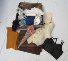 A bygone suit case containing ladies and gents mid 20th Century clothing, underwear and fashion