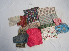 A box of assorted cotton and linen vibrant prints circa 1930's - 1960's small scale prints for