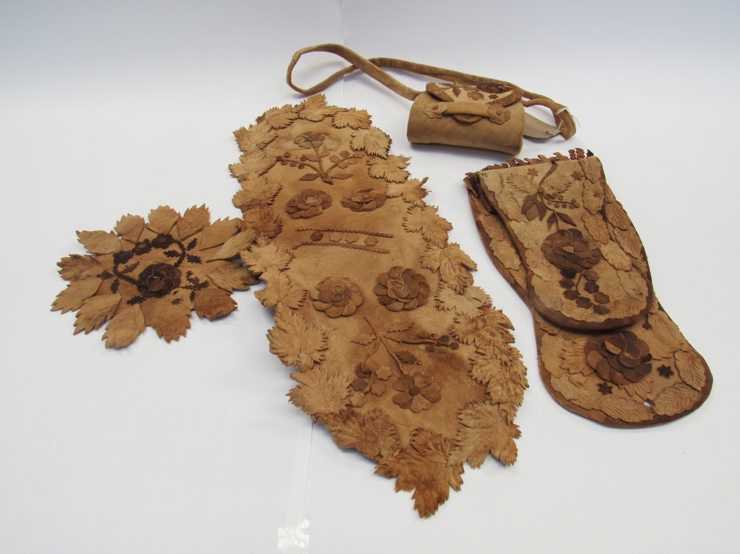 Native American circa 1900's chamois leather applique pieces to include a small handbag and other