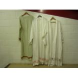 Five white linen and cotton religious surplices, two with bands of Greek key design