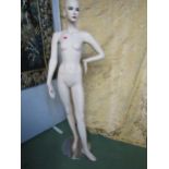 A mid 20th Century female full mannequin on circular white metal base