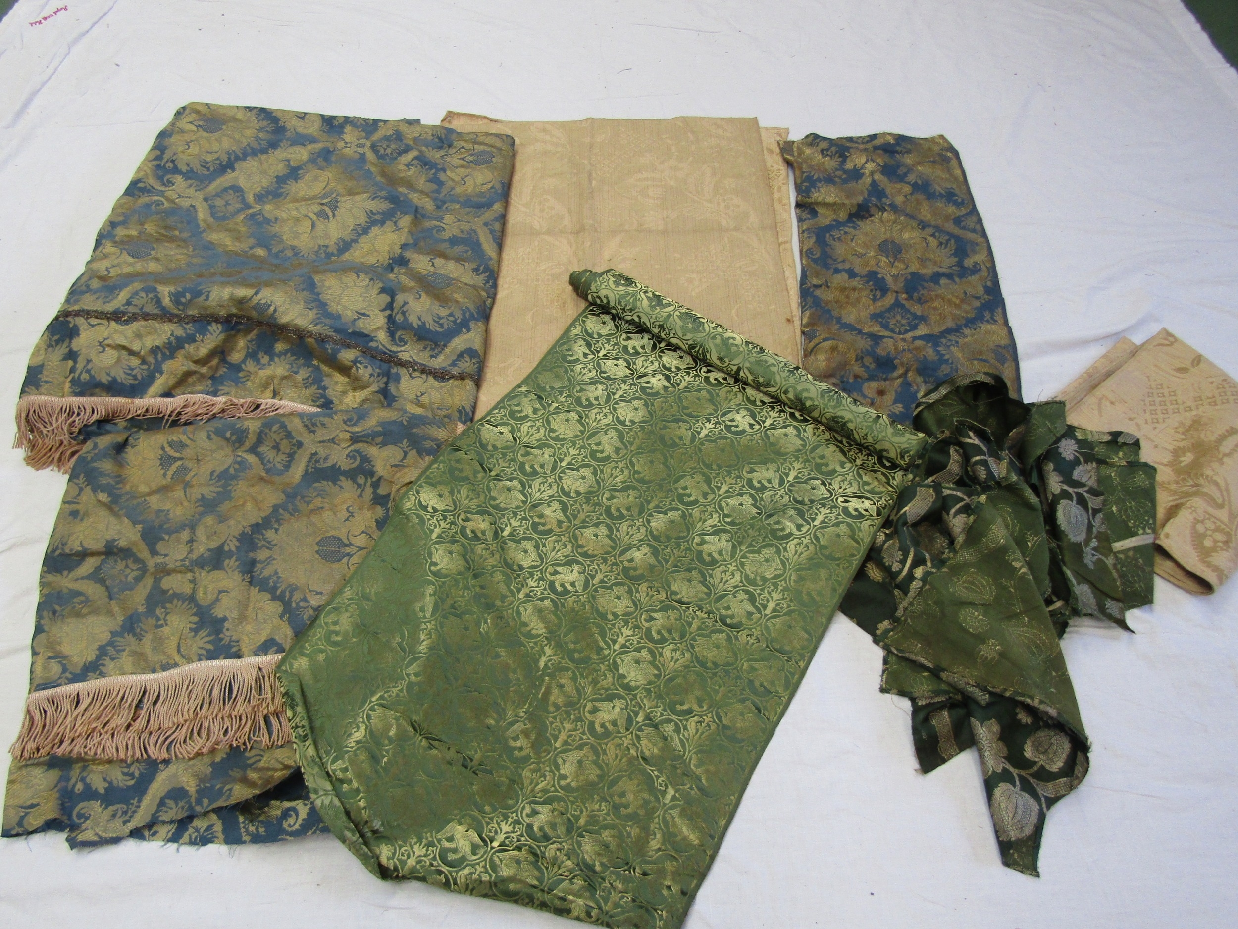 Four yards approx of 19th Century green and silk brocade with gold thread, griffin design,