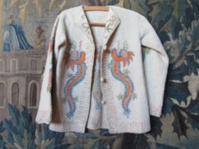 A 1920's cream wool tailored jacket, Asian influence with an applique embroidered pattern, bobble