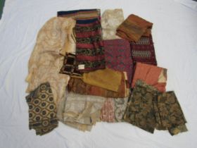 Approximately twenty five pieces of fabric to include silk damasks, velvet, tapestry, paisley