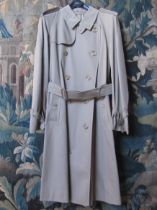A Burberry gents trench coat, retail label still applied. 46RL