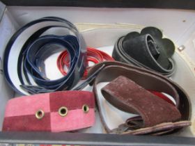 A box of vintage belts and buckles