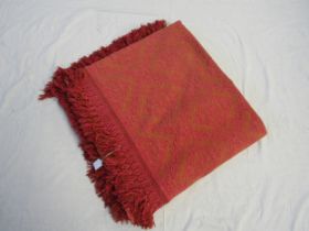 A 1970's pink and orange bed throw
