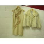 1960's cream raw silk sleeveless dress, the front displays an ornate naturalistic beaded design, zip