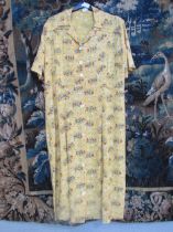 A CC41 marigold floral print tea-dress, a pair of calf skin CC41 gloves, a brown leather clutch