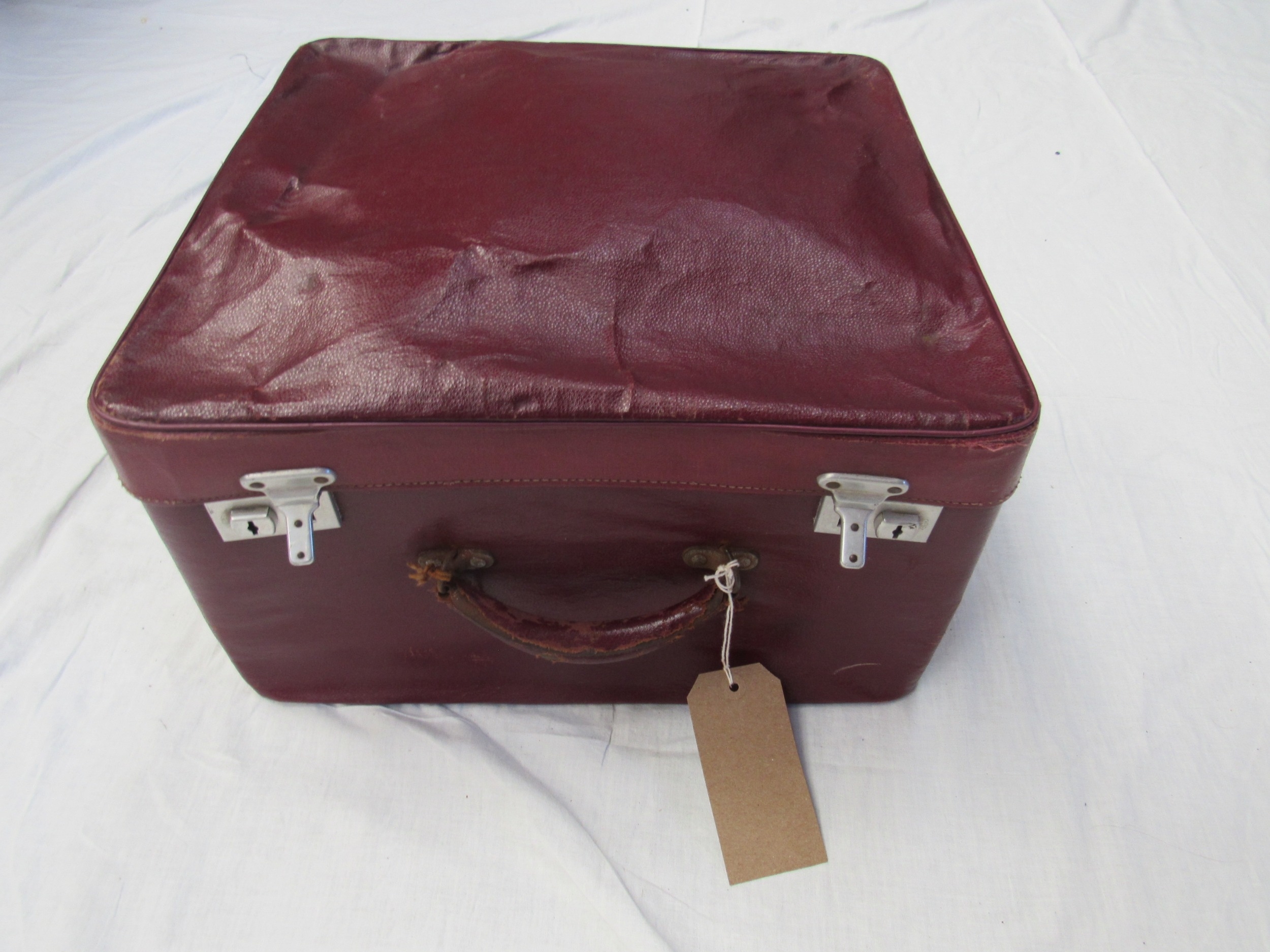 A small burgundy leather traveling case with original travel provenance labels containing mainly - Image 2 of 4