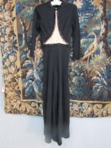 LILLIE Ruben: A black full length jersey crepe evening cat-suit with black beading to the round