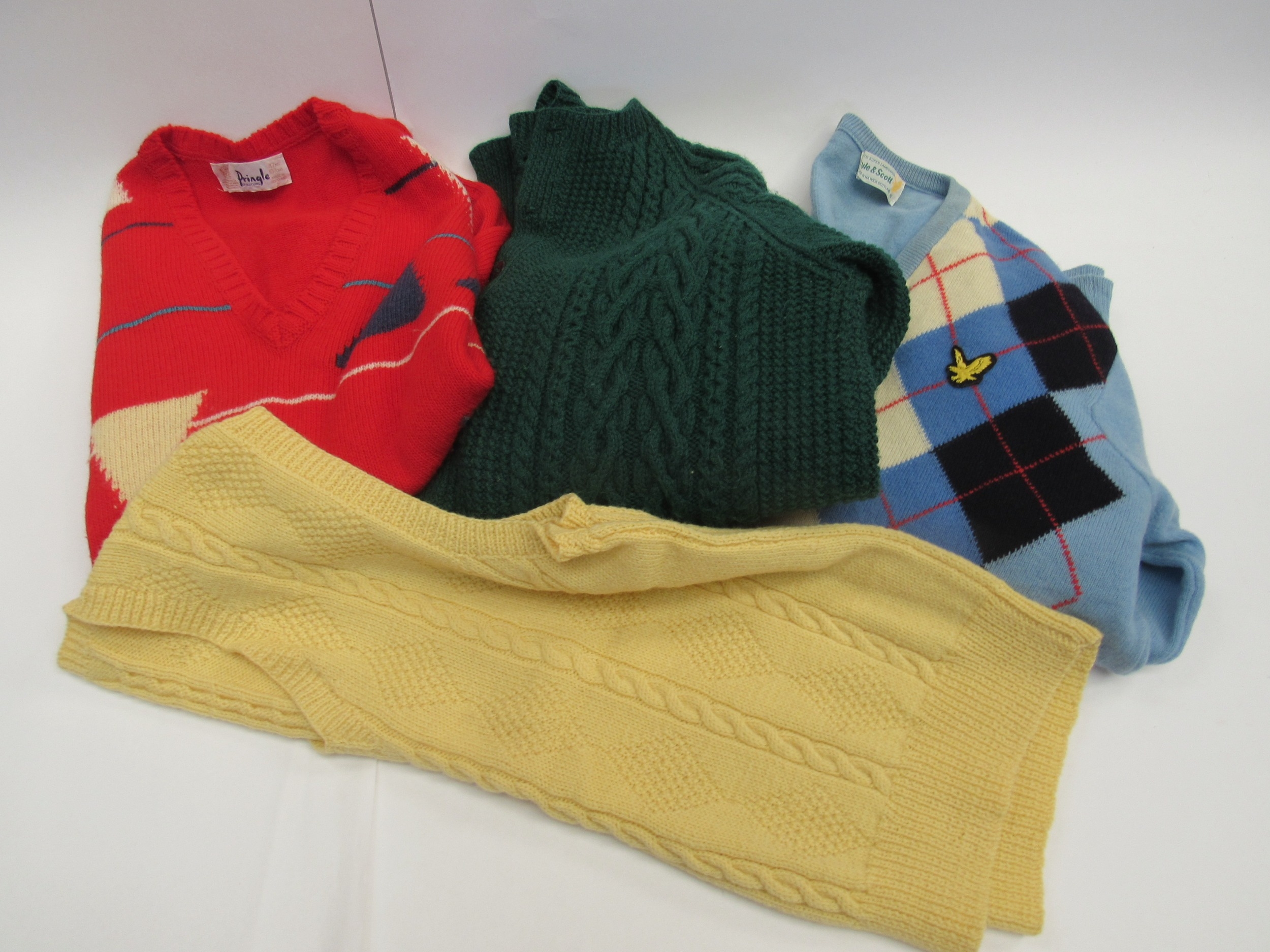 A box containing four pieces of gents vintage knitwear to include Lyle & Scott and Pringle