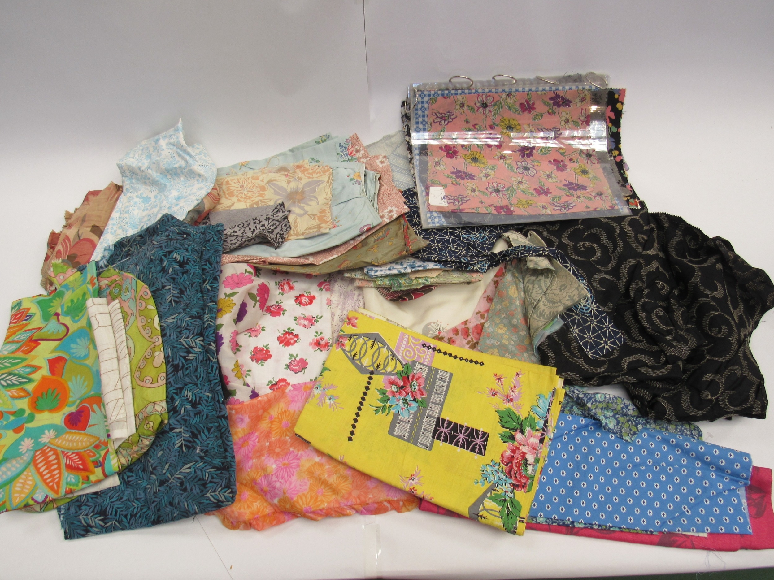 A large bag comprising approximately 50 designs large and medium scale fabrics, 1940's, 50's and