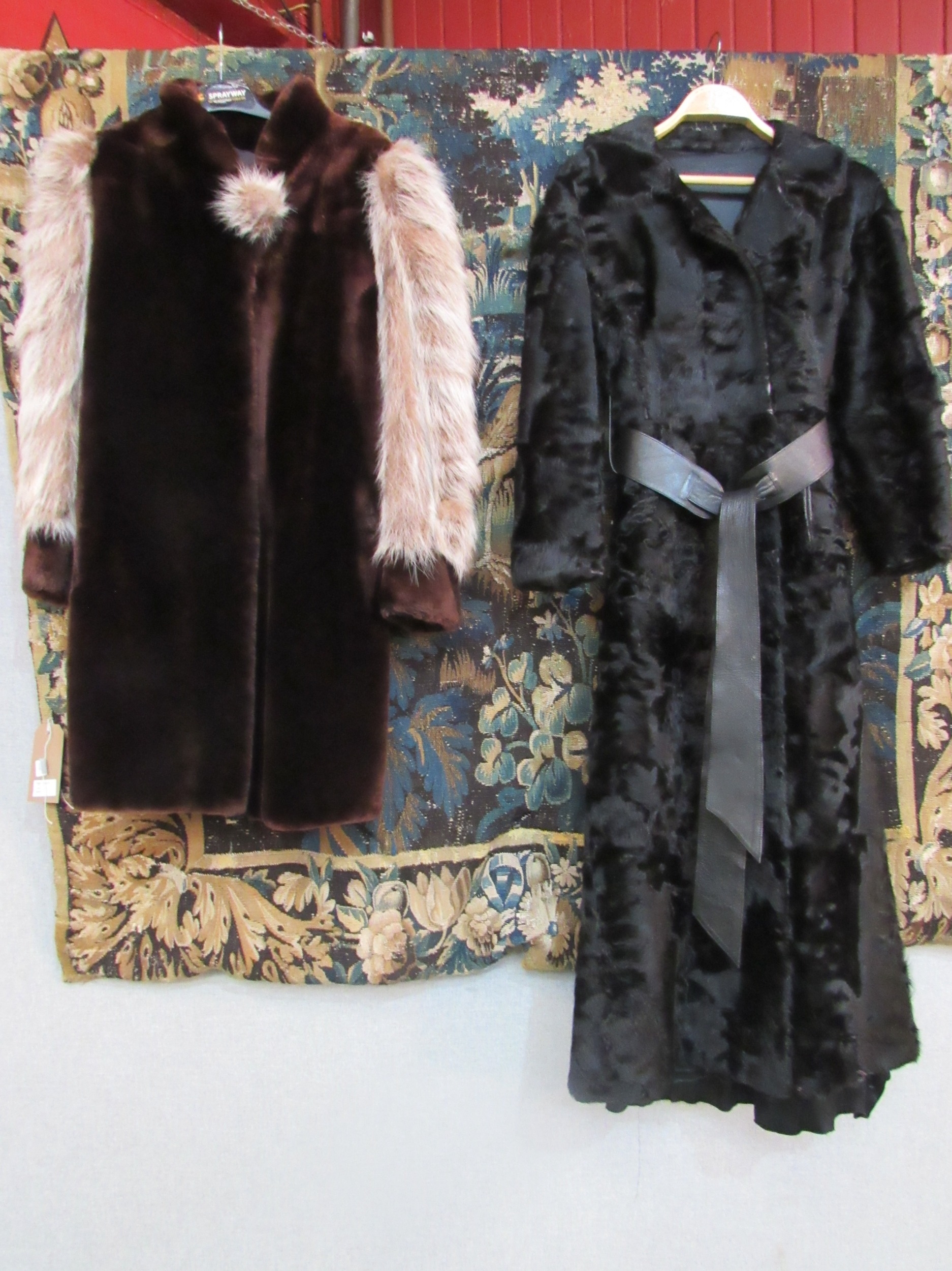 A black Persian lamb ladies 3/4 length coat, the coat has a slight outswept look bearing a black