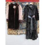 A black Persian lamb ladies 3/4 length coat, the coat has a slight outswept look bearing a black