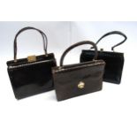 Three mid 20th Century snakeskin handbags, two brown, one black and a small quantity of ladies