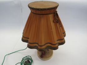 A Goebel late 1940's table lamp, young girl perched on a tree with dog at her feet holding her