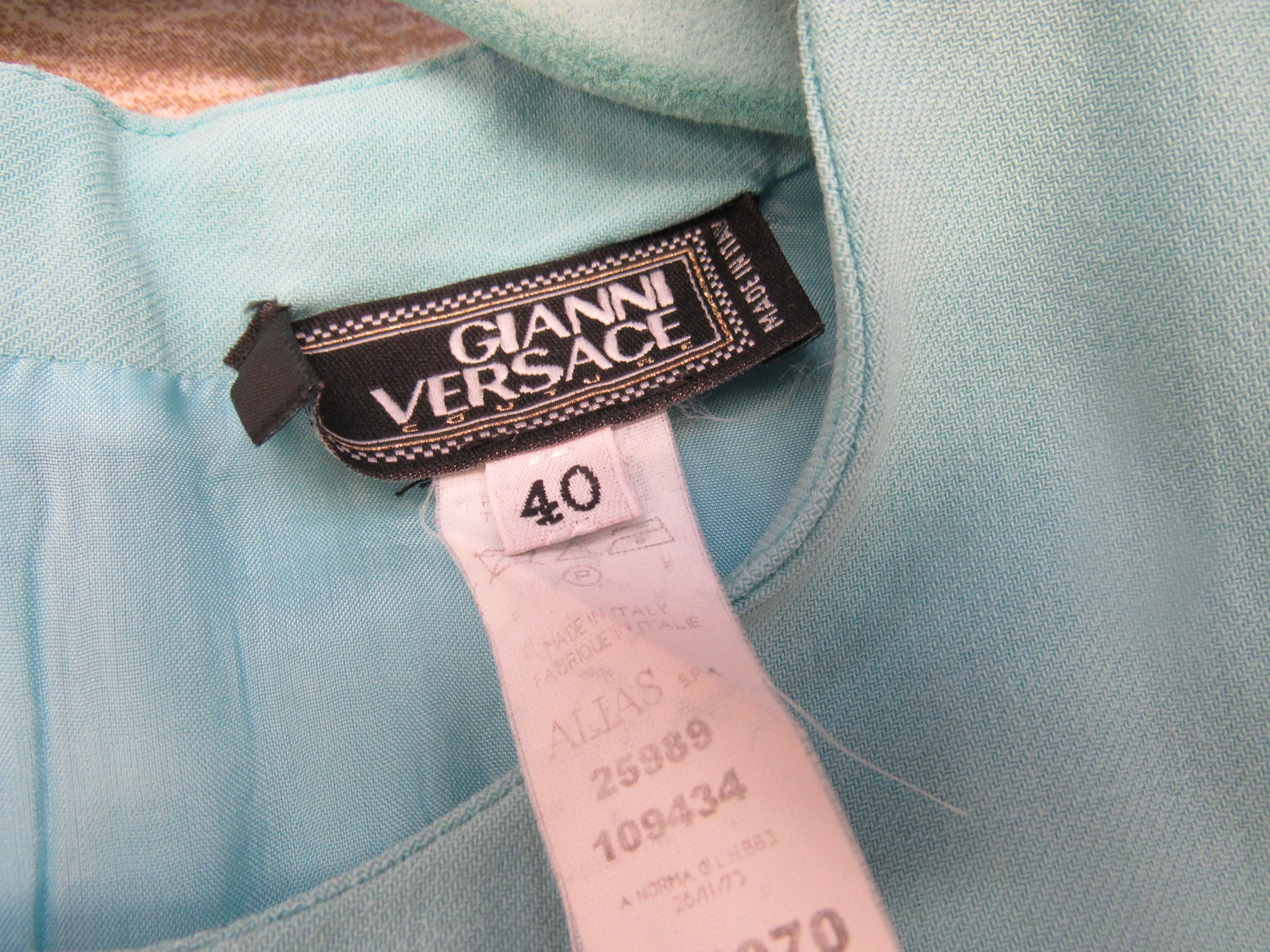 GIANNI VERSACE: Turquoise wool sleeveless dress, seamed design with a slight fishtail swing pleat to - Image 2 of 2