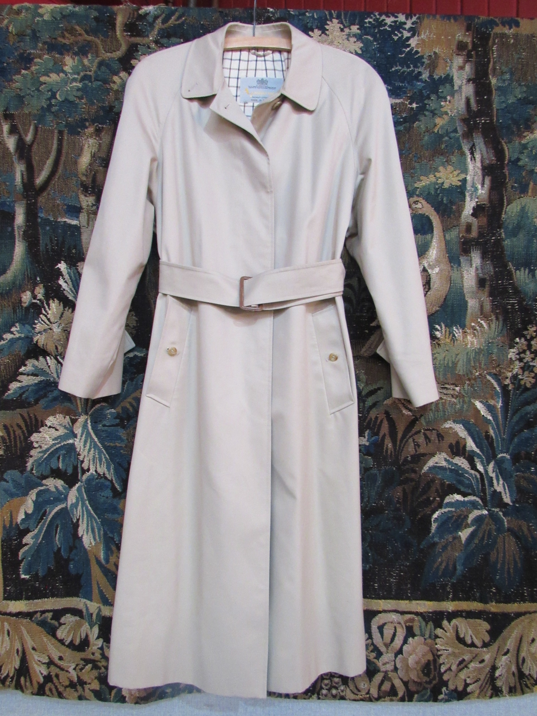 An Aquascutum lady's single breasted rain-mac with belt