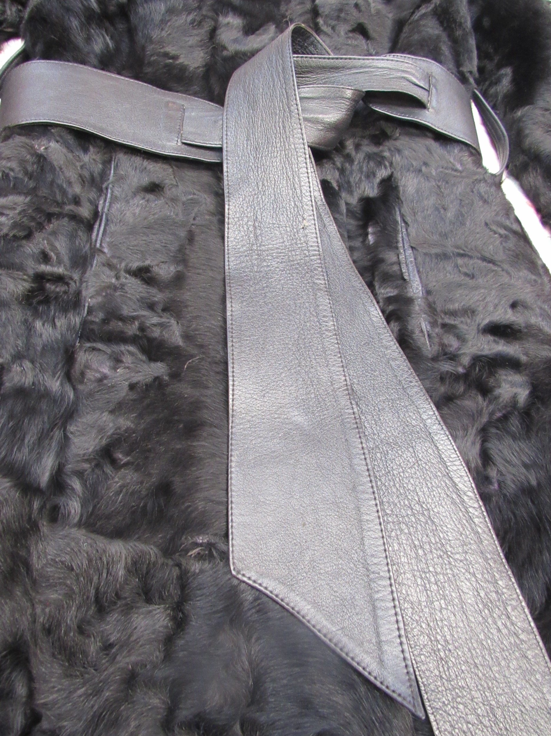 A black Persian lamb ladies 3/4 length coat, the coat has a slight outswept look bearing a black - Image 2 of 3