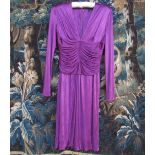 VERSACE: A purple viscose and rayon long sleeve dress with a heavily ruched bodice and deep "V"