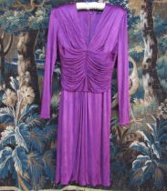 VERSACE: A purple viscose and rayon long sleeve dress with a heavily ruched bodice and deep "V"