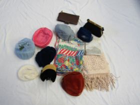 A box containing middle 20th Century fashion accessories to include hats, shawls, gloves, a tabard
