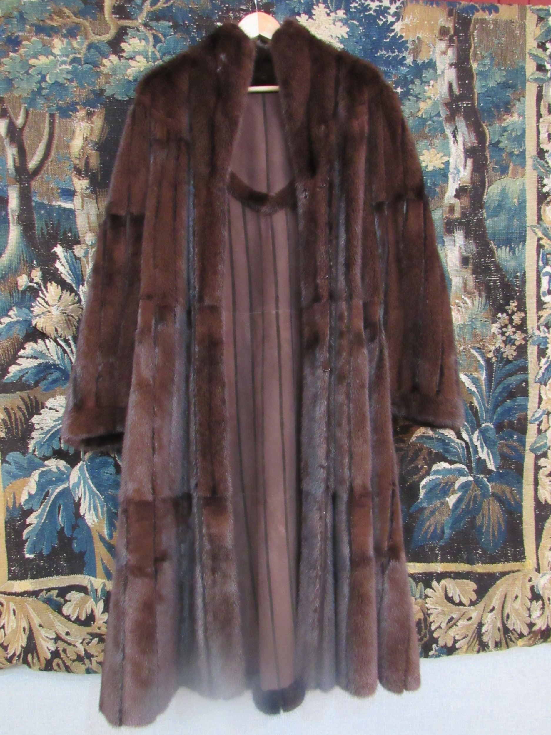 A dark brown Mink and Suede reversible coat, the pelts are of a fabulous quality, the coat is