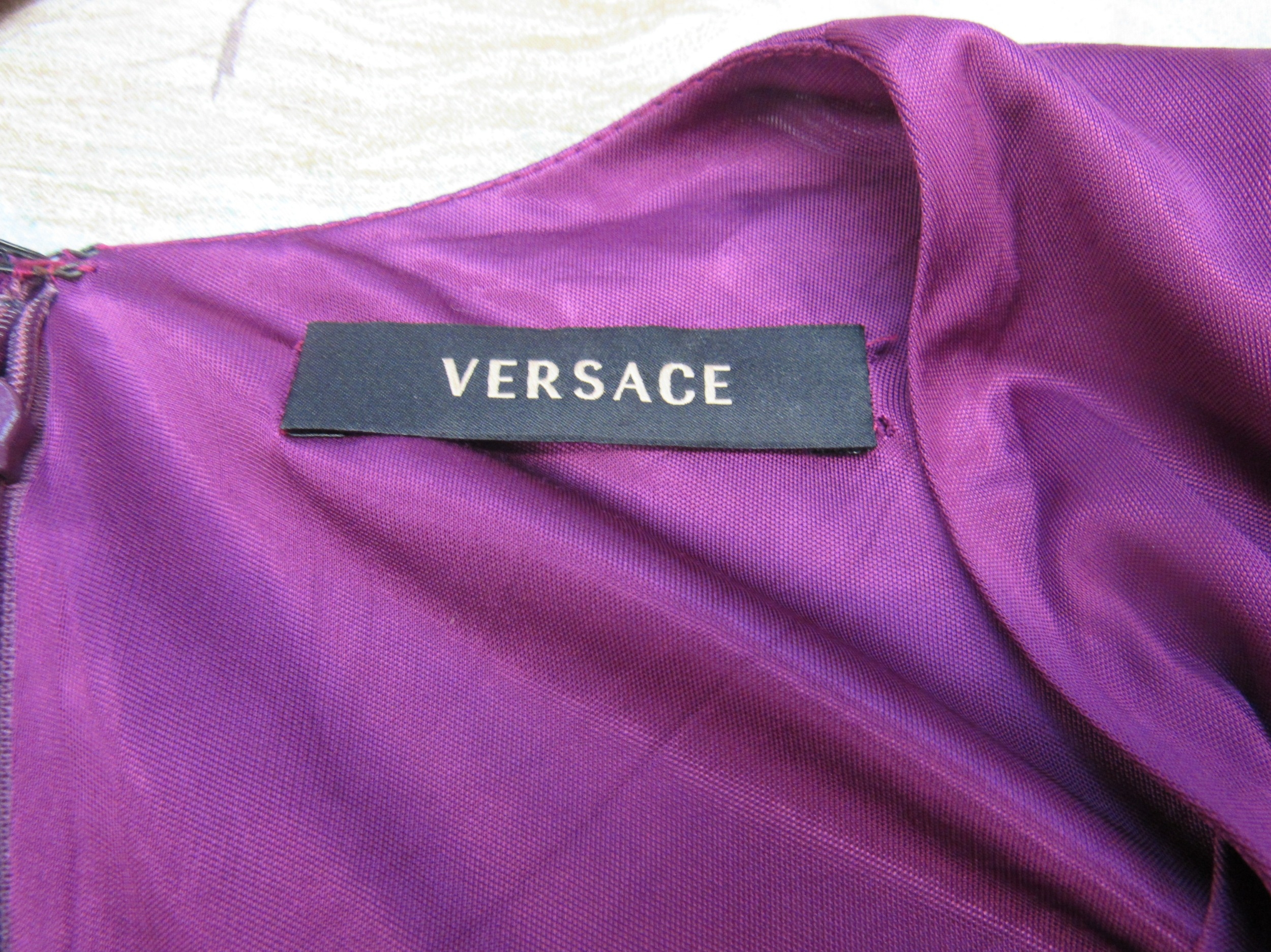 VERSACE: A purple viscose and rayon long sleeve dress with a heavily ruched bodice and deep "V" - Image 3 of 5