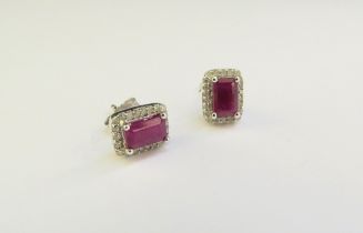 A pair of 18ct white gold ruby and diamond earrings