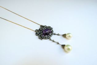 A Victorian seed pearl, diamond and cabochon amethyst set pendant with pearl drops on diamond set