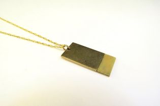 A 9ct gold pendant, 6.3g hung on a gold chain stamped 14k, 44cm long, 1.5g